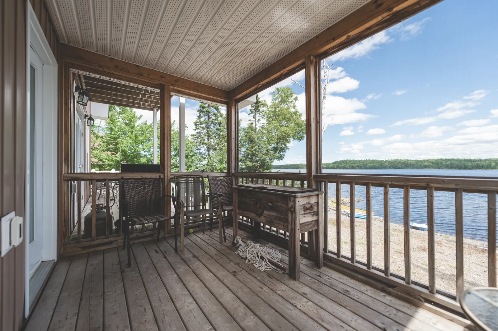 The screened porch looking out over the pond