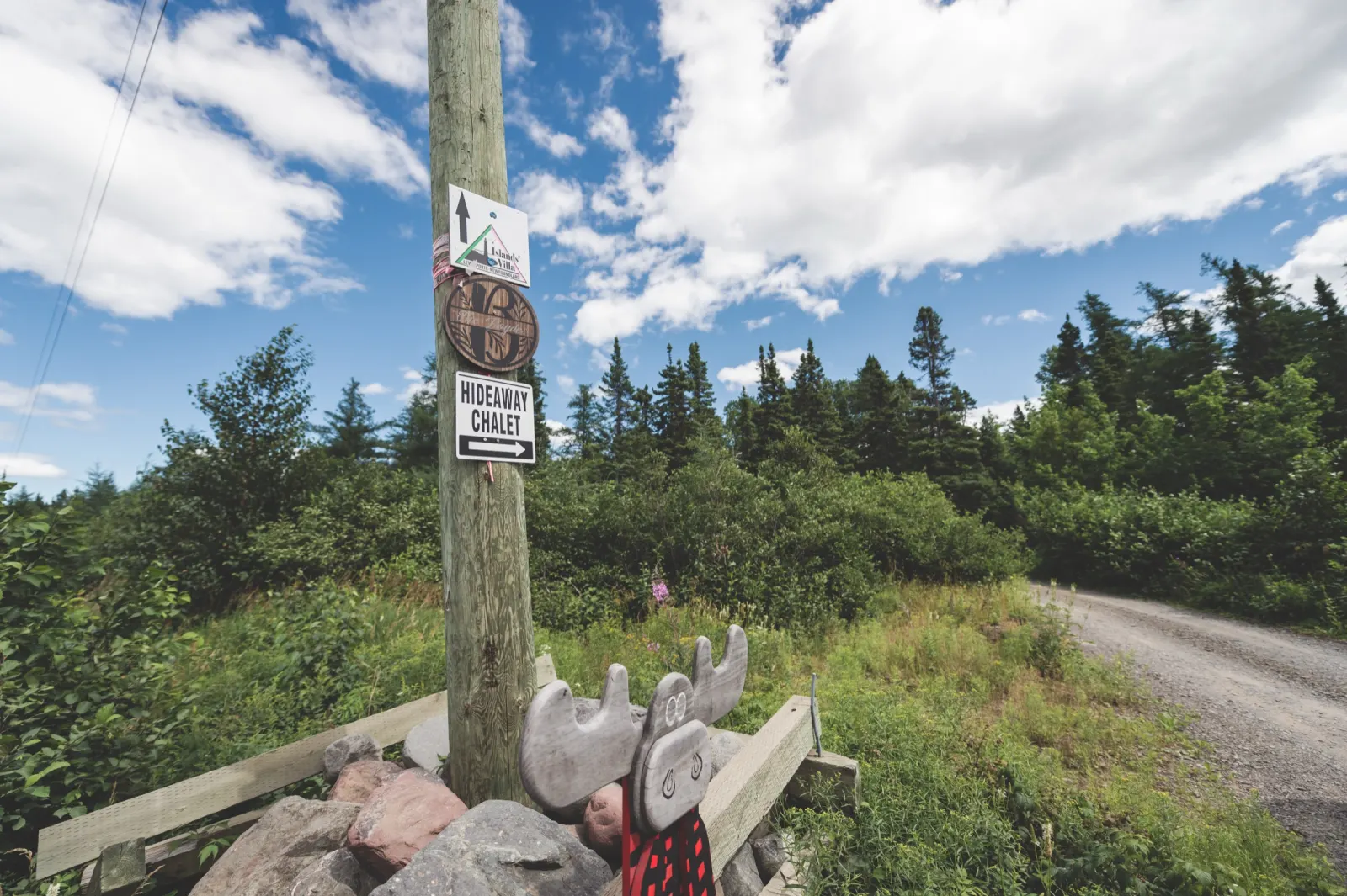 The Hideaway Chalet road sign at the turn off the road
